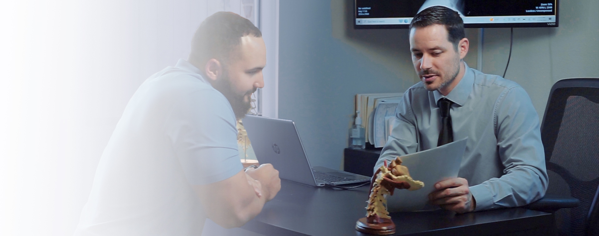 Dr. Johnson consulting with patient at Integrated Chiropractic